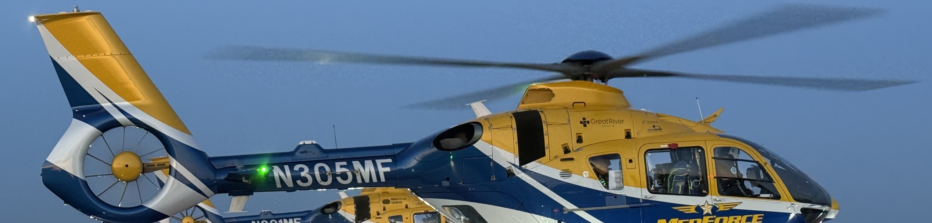 team running to helicopter 