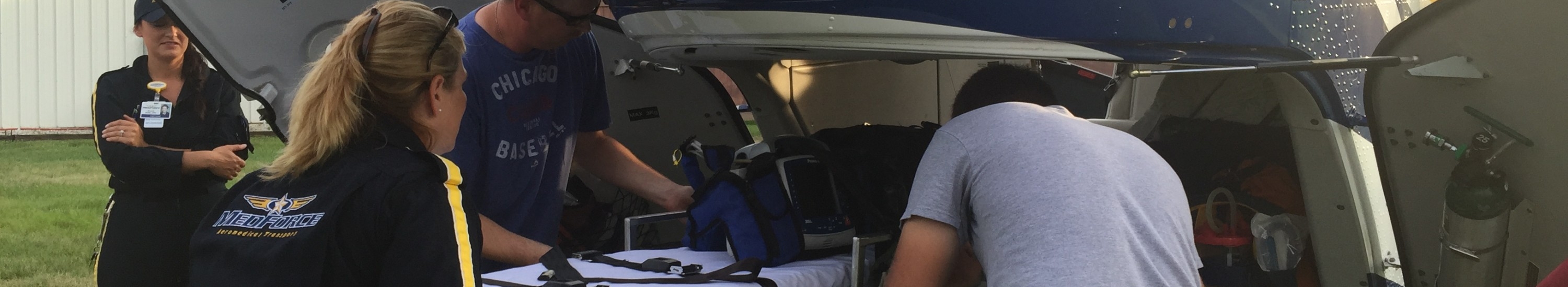 medforce crew loading patient into medforce aircraft